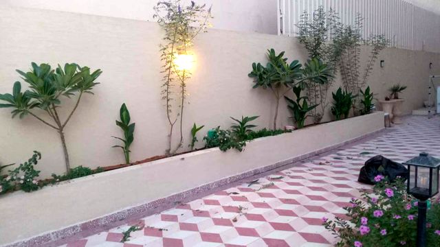Planter beds along a villa wall